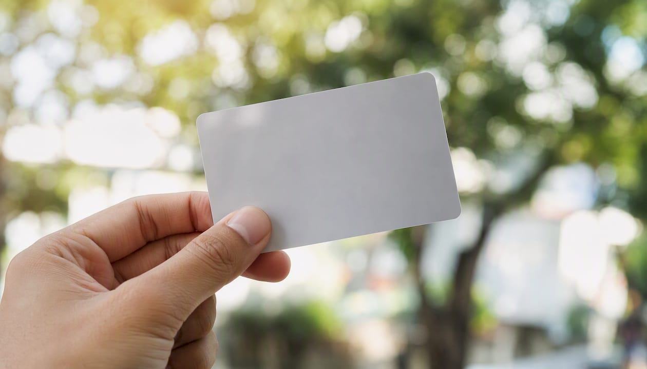 Hand holding generic health insurance card